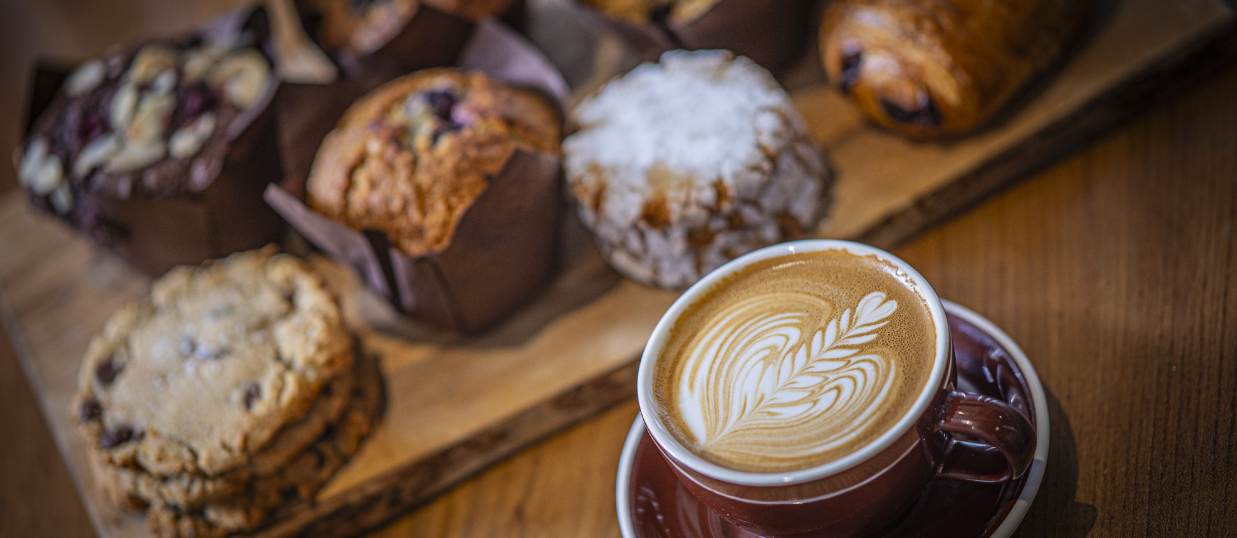 Coffee and muffins on a table.
