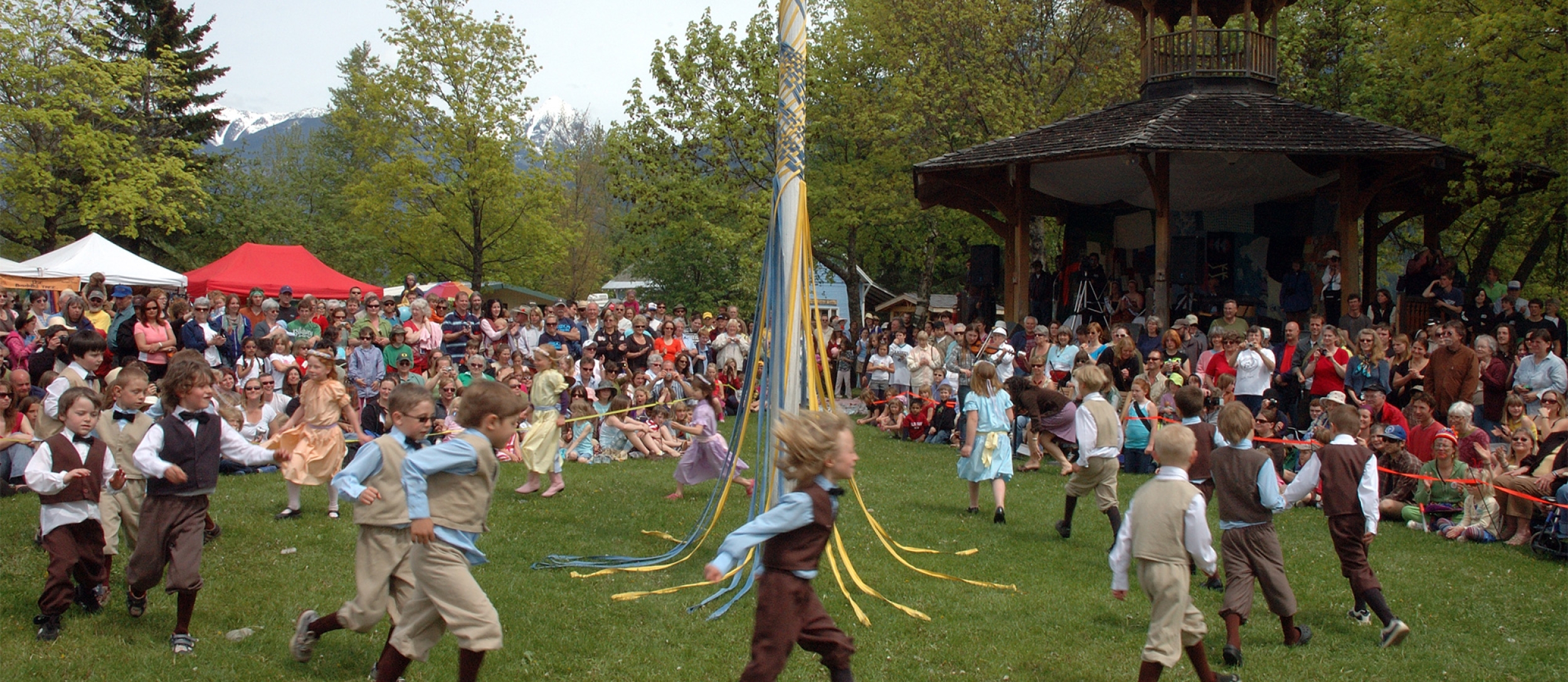 Kids doing the traditional May Pole dance during Kaslo May Days.