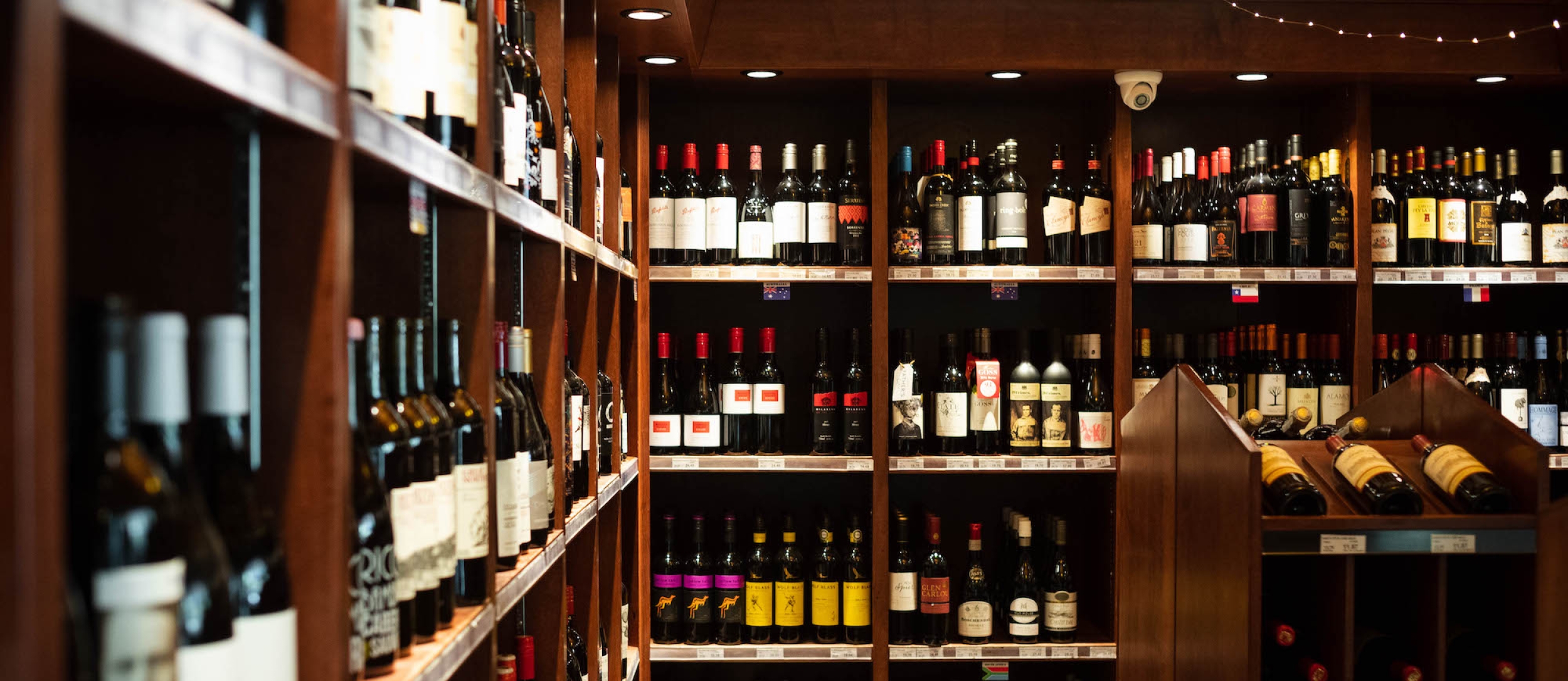 Wine bottles line the shelves at the Grand Liquor Merchant