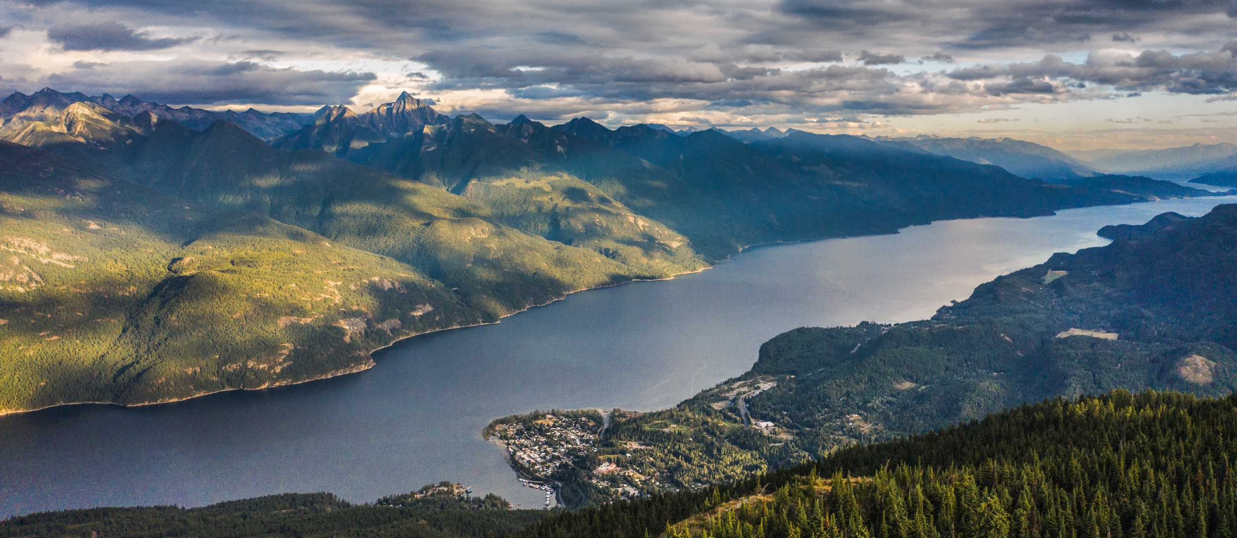 Aerial shot of kaslo and kootenay lake in the summer.