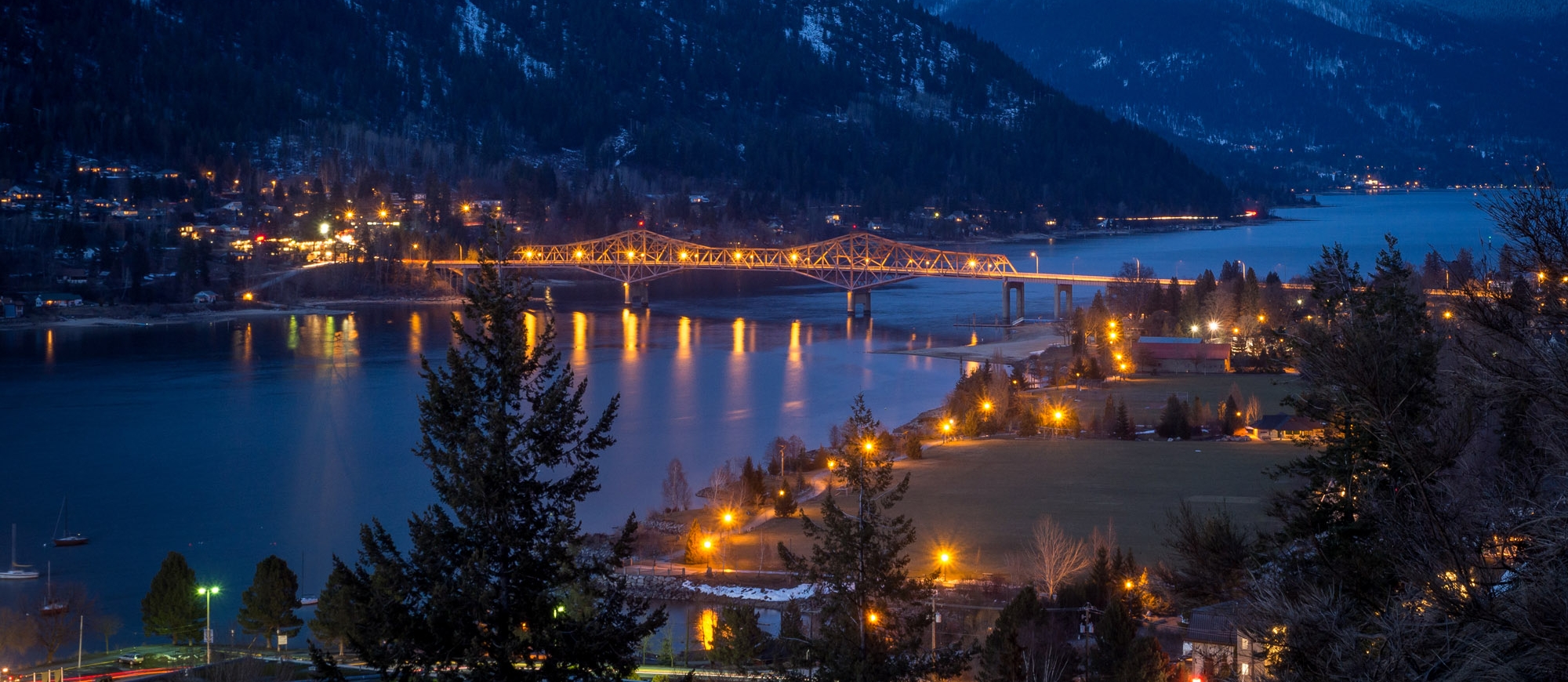 Nelson, BC and the Big Orange Bridge lit up at night.