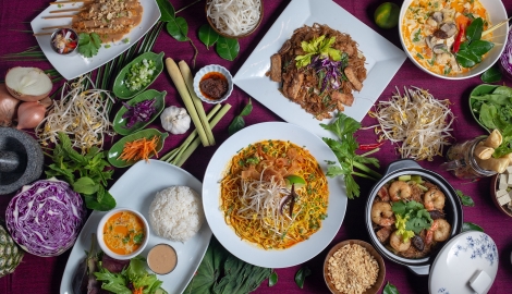 A table with a variety of colourful food at Busaba Thai Cafe in Nelson, BC