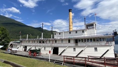 the SS Moyie and Visitor Centre sits with mountains in the background in Kaslo, BC