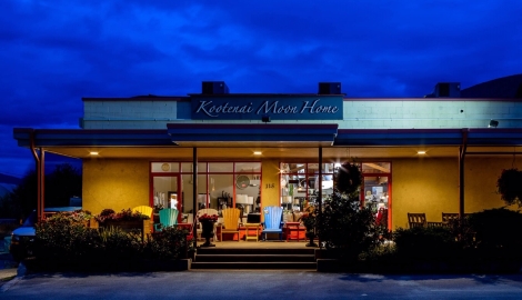 The Kootenai Moon Furniture store lit up at night