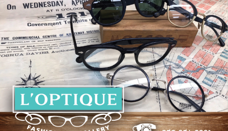 Sunglasses and reading glasses scattered on a table.