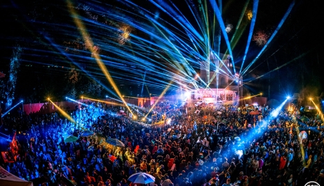 fans fill the dancefloor of the Pagoda Stage as it lights up with blue lazer lights at Shambhala Music Festival