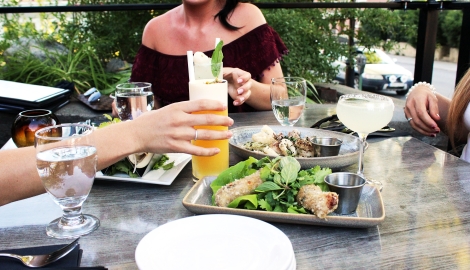 Three people sitting on the patio at Yum Son in Nelson, BC