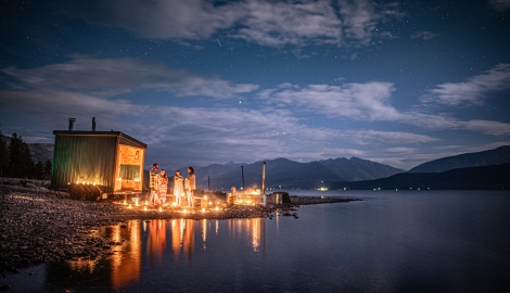 A portable sauna on the shore of Kootenay Lake in the evening.