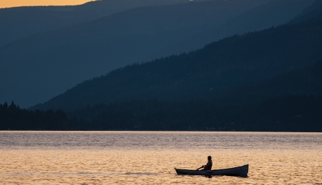 Person paddling in their canoe.