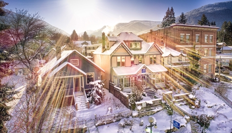 an aerial view of the cloudside motel with sun rays shining through