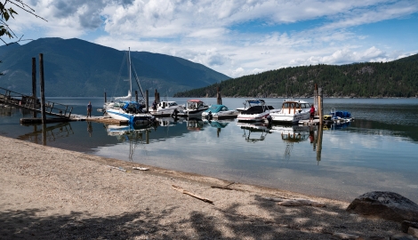 View of the marina with mountains in the background at The Lakeview in Gray Creek near Crawford Bay, BC