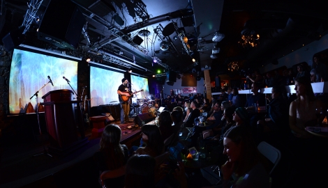 A musician playing a guitar in Spiritbar during the Kootenay Music awards