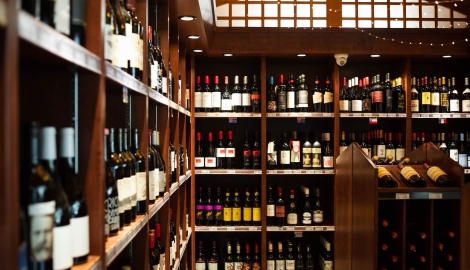 Wine bottles line the shelves at the Grand Liquor Merchant